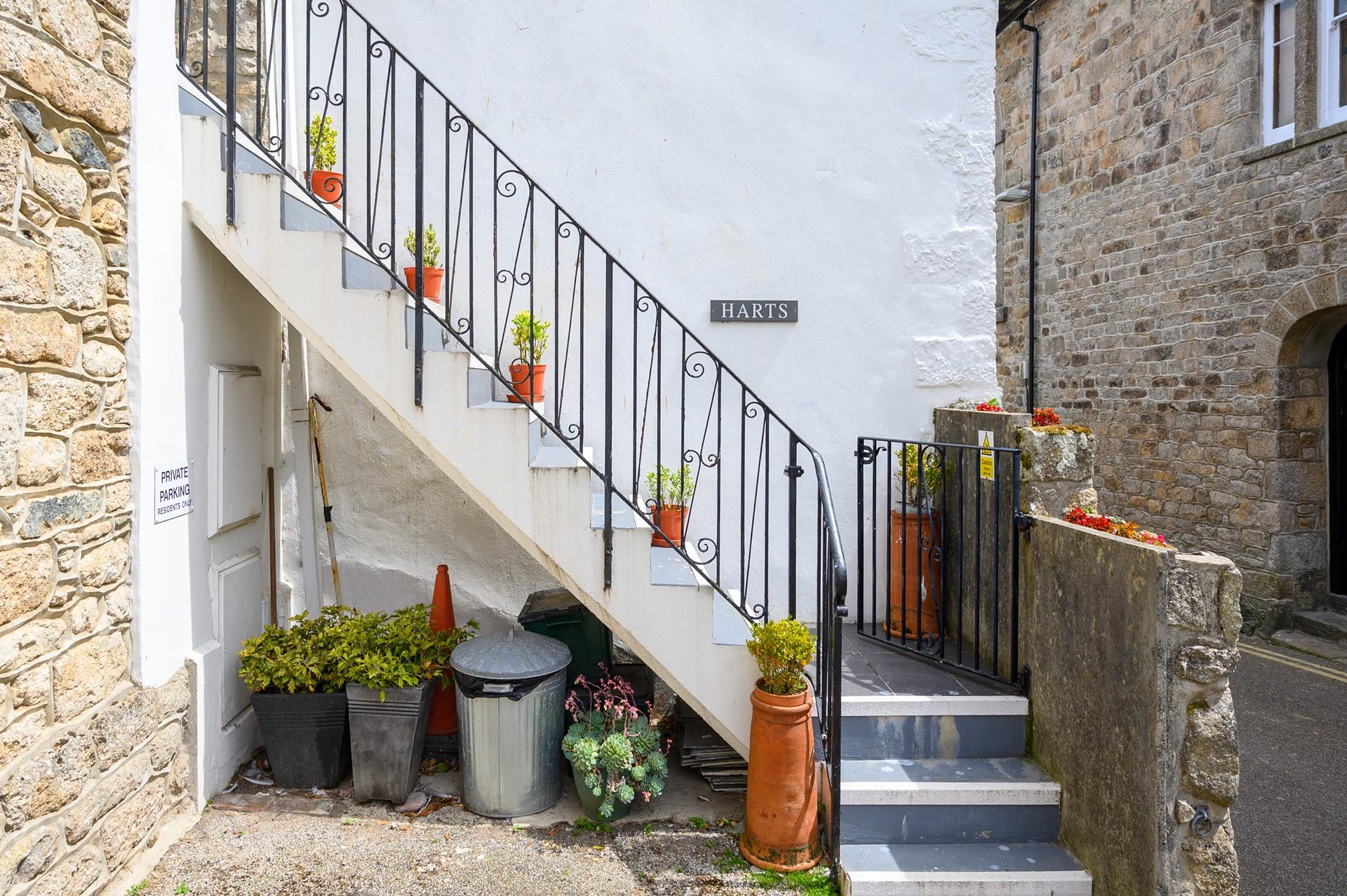 There is a private parking space just adjacent to the stone steps.