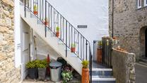 There is a private parking space just adjacent to the stone steps.