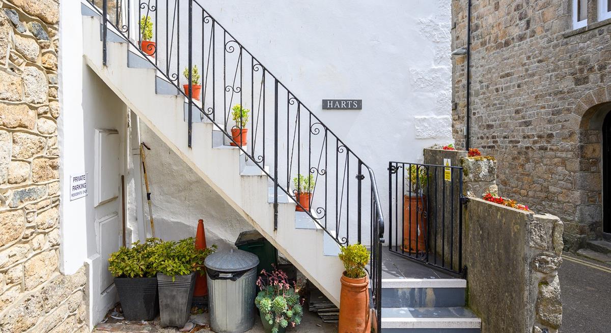 There is a private parking space just adjacent to the stone steps.