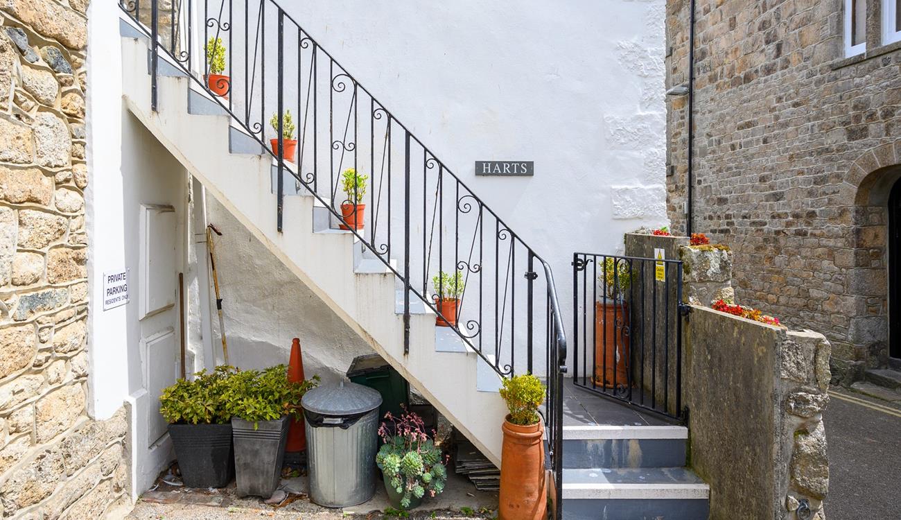 There is a private parking space just adjacent to the stone steps.