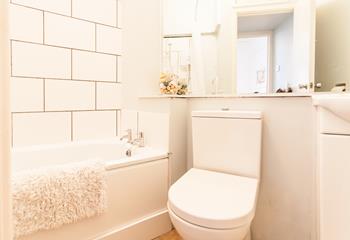 The bathroom is bright and fresh, an ideal space to start your day!