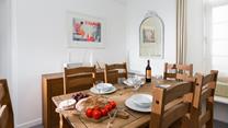 Traditional wood furniture combined with neutral interiors adds a subtle nautical vibe.