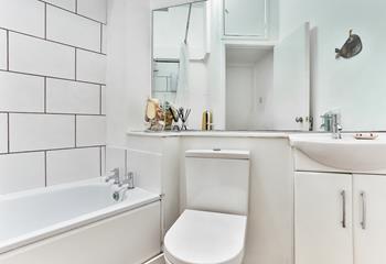 The bathroom is bright and fresh, an ideal space to start your day!