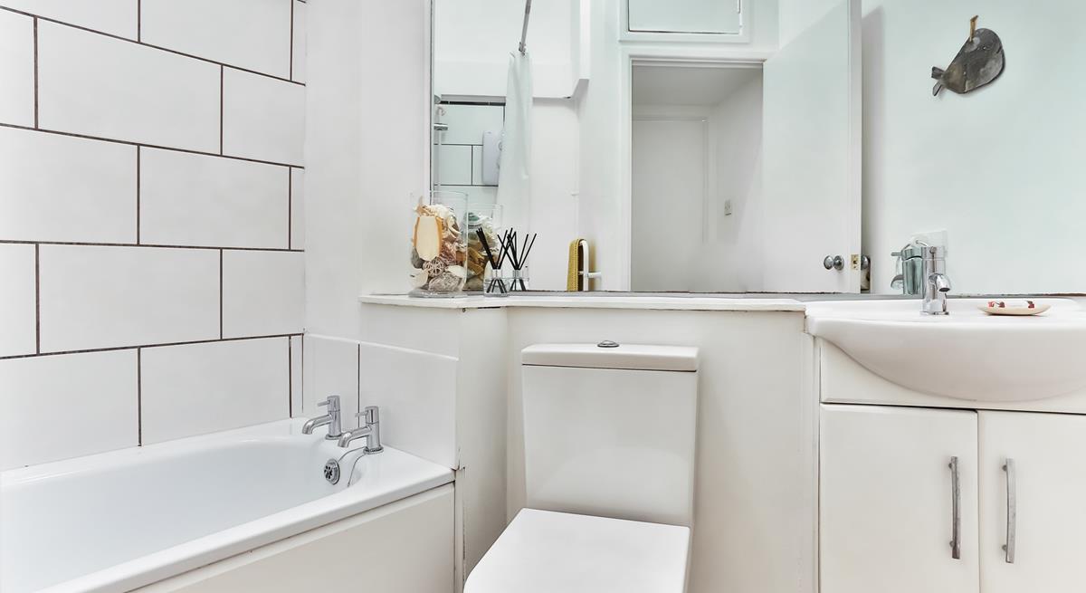 The bathroom is bright and fresh, an ideal space to start your day!