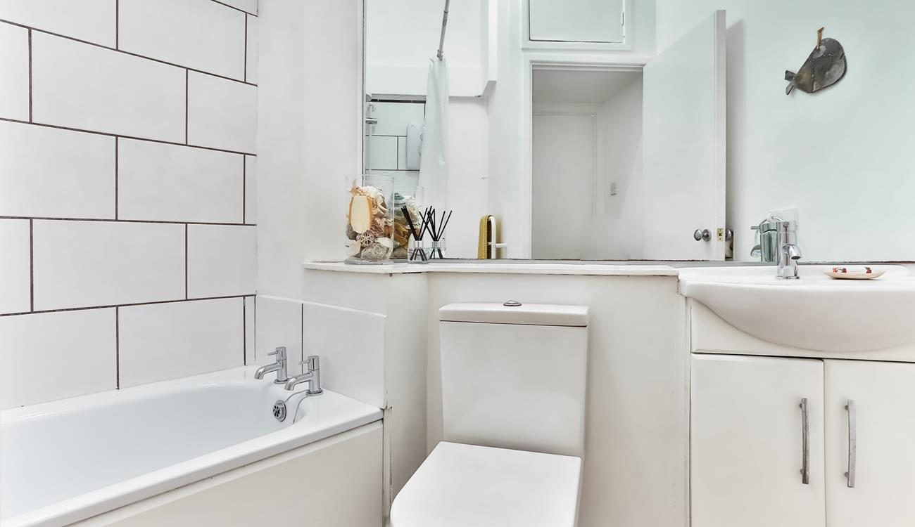 The bathroom is bright and fresh, an ideal space to start your day!