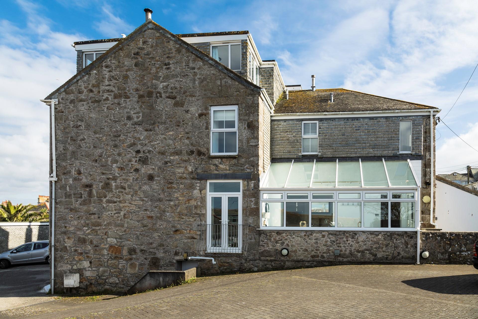 There is a large parking area, enough to fit three cars comfortably. 