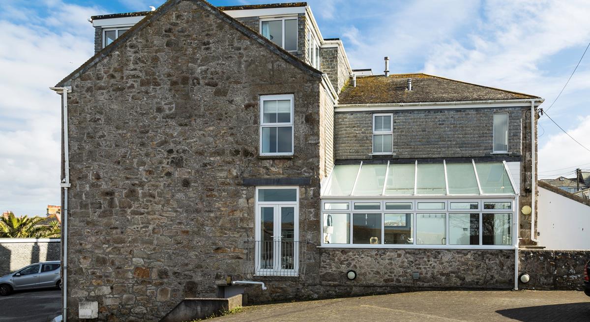 There is a large parking area, enough to fit three cars comfortably. 