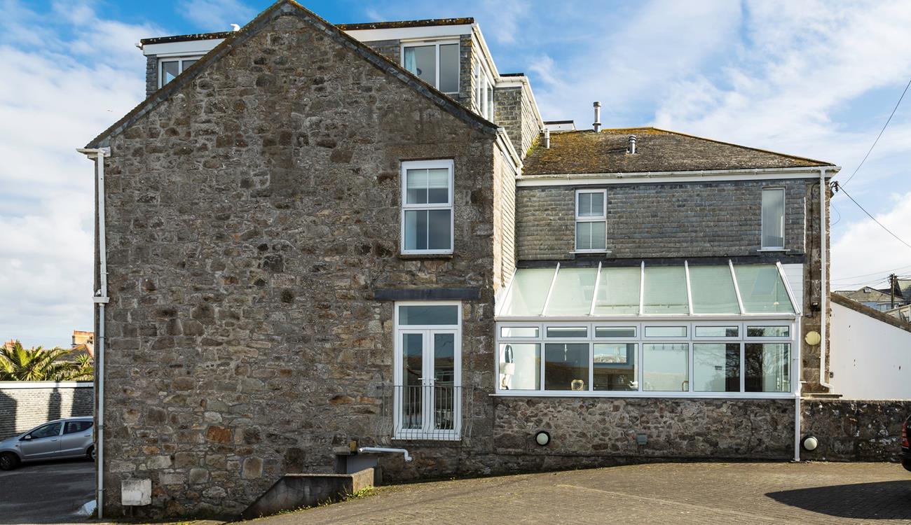 There is a large parking area, enough to fit three cars comfortably. 