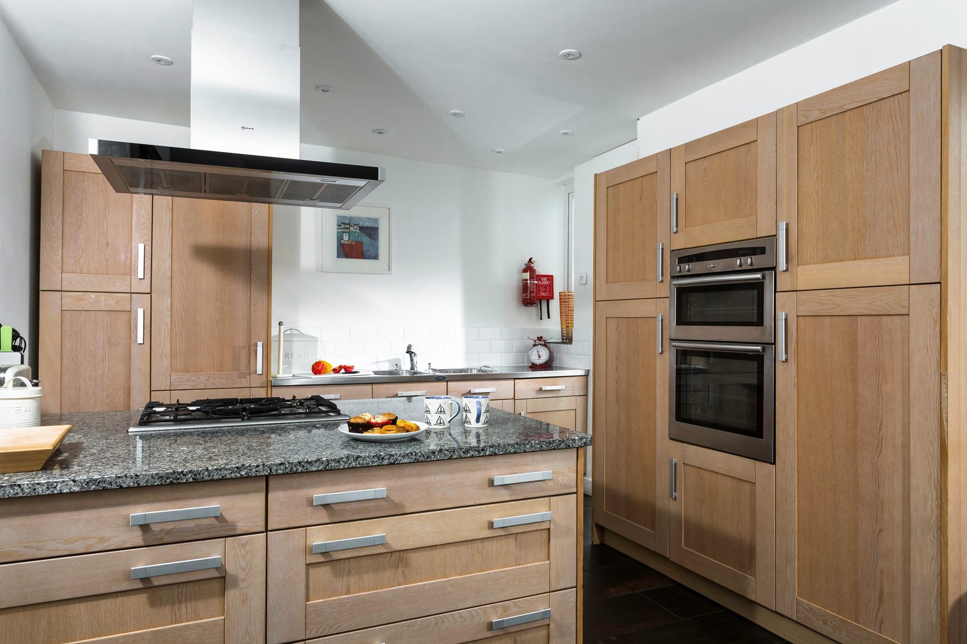 The kitchen is spacious and well-equipped for all your culinary needs.