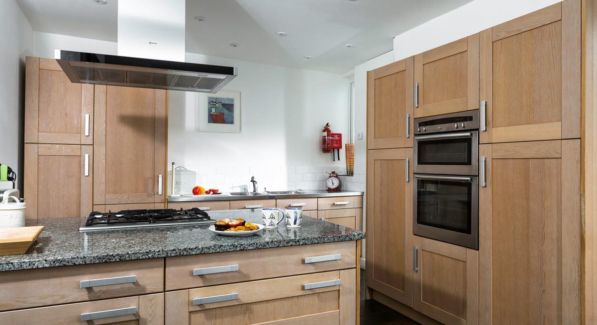 The kitchen is spacious and well-equipped for all your culinary needs.