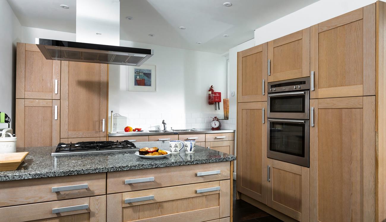 The kitchen is spacious and well-equipped for all your culinary needs.