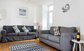 Lovely Cornish artwork fills the walls of the sitting room. - Thumbnail Image
