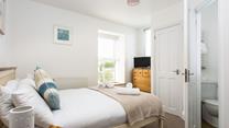 Wake up and wander into the en suite to get ready for the day.