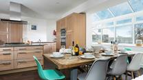 The kitchen/dining area is light and spacious for cooking and dining together.