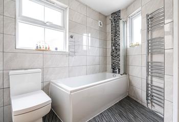 Stylish with a bath and shower over, the family bathroom is ideal for washing away the salt and sand after a day at the beach.