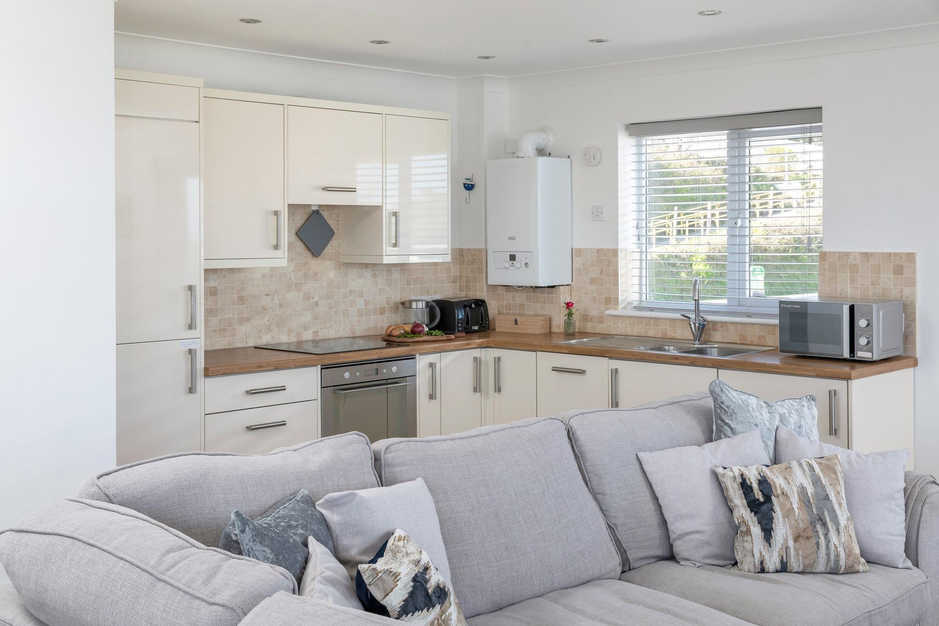 Sink into the sumptuous sofas and relax while dinner is cooking in the kitchen. 