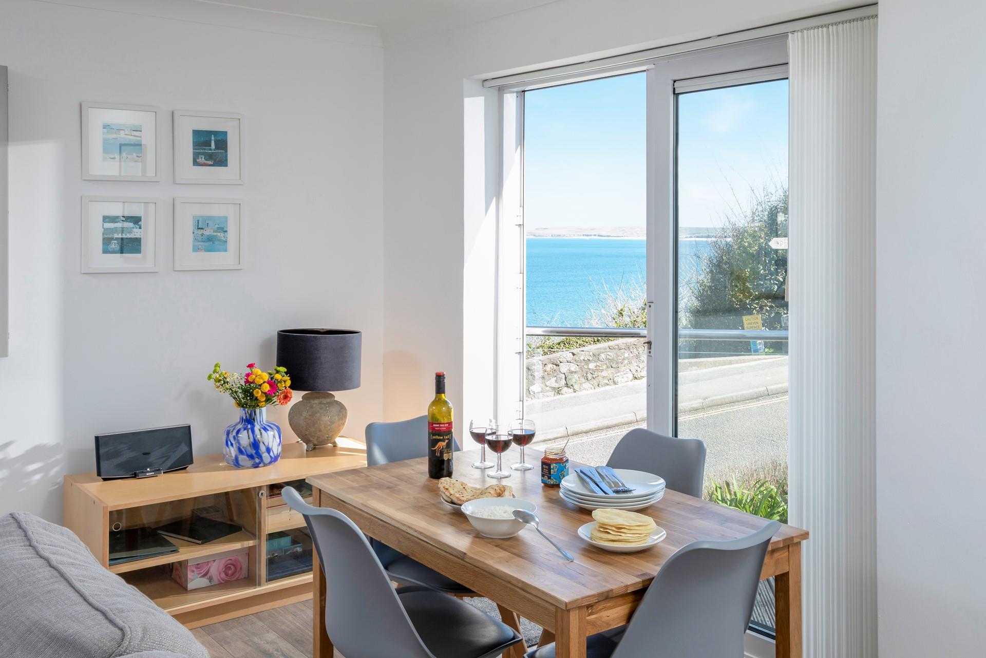 Admire the view whilst gathered together around the dining table.