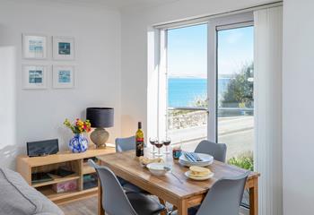 Admire the view whilst gathered together around the dining table.