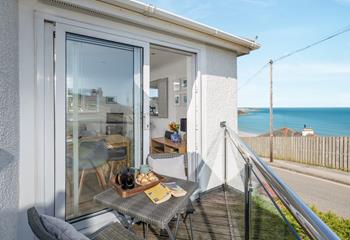 Step onto the decked balcony and watch the waves ebb and flow.