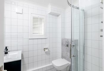 The shower room is modern and sleek.