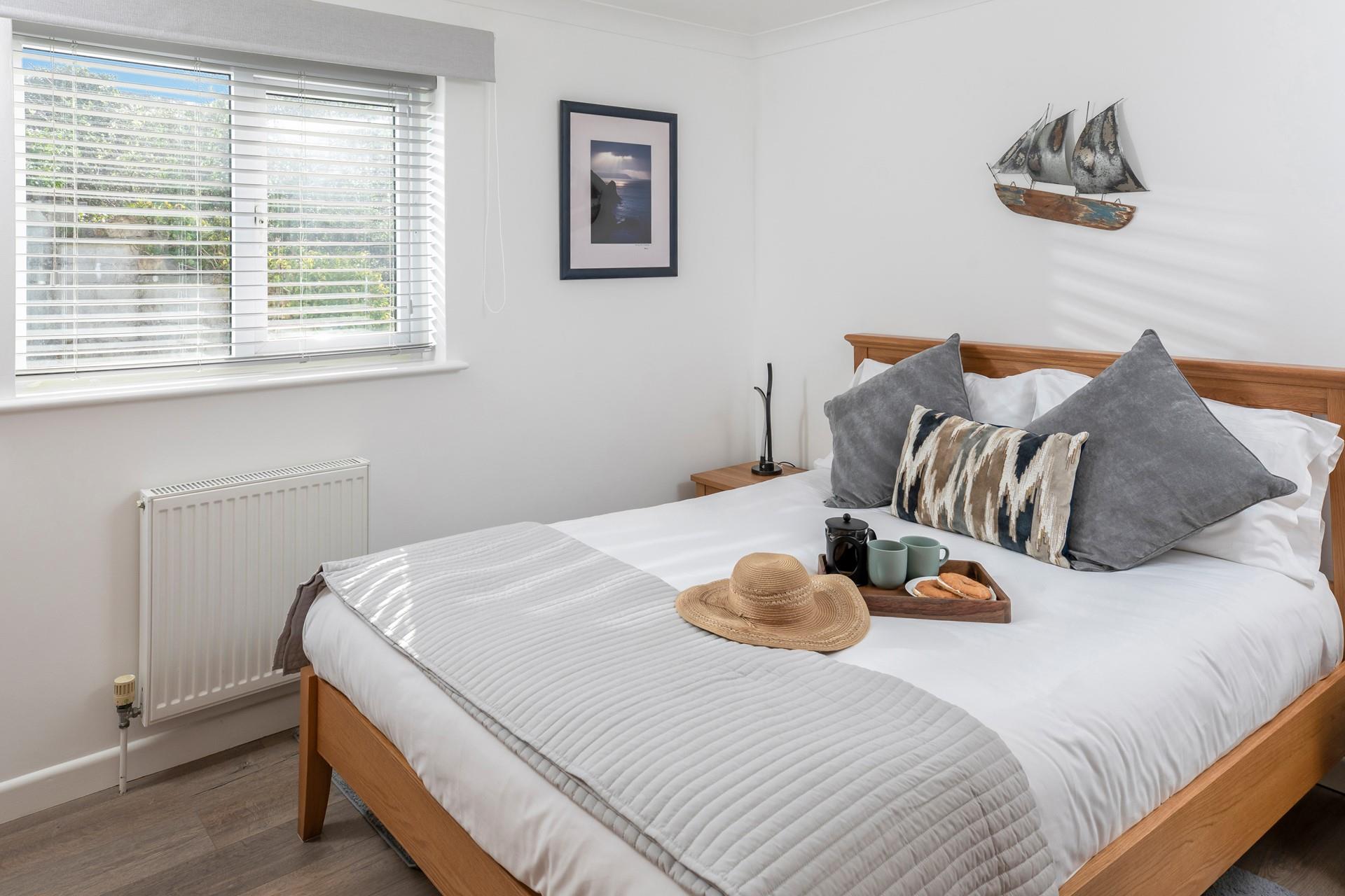 Bedroom 1 is elegantly decorated and provides a peaceful night's sleep.