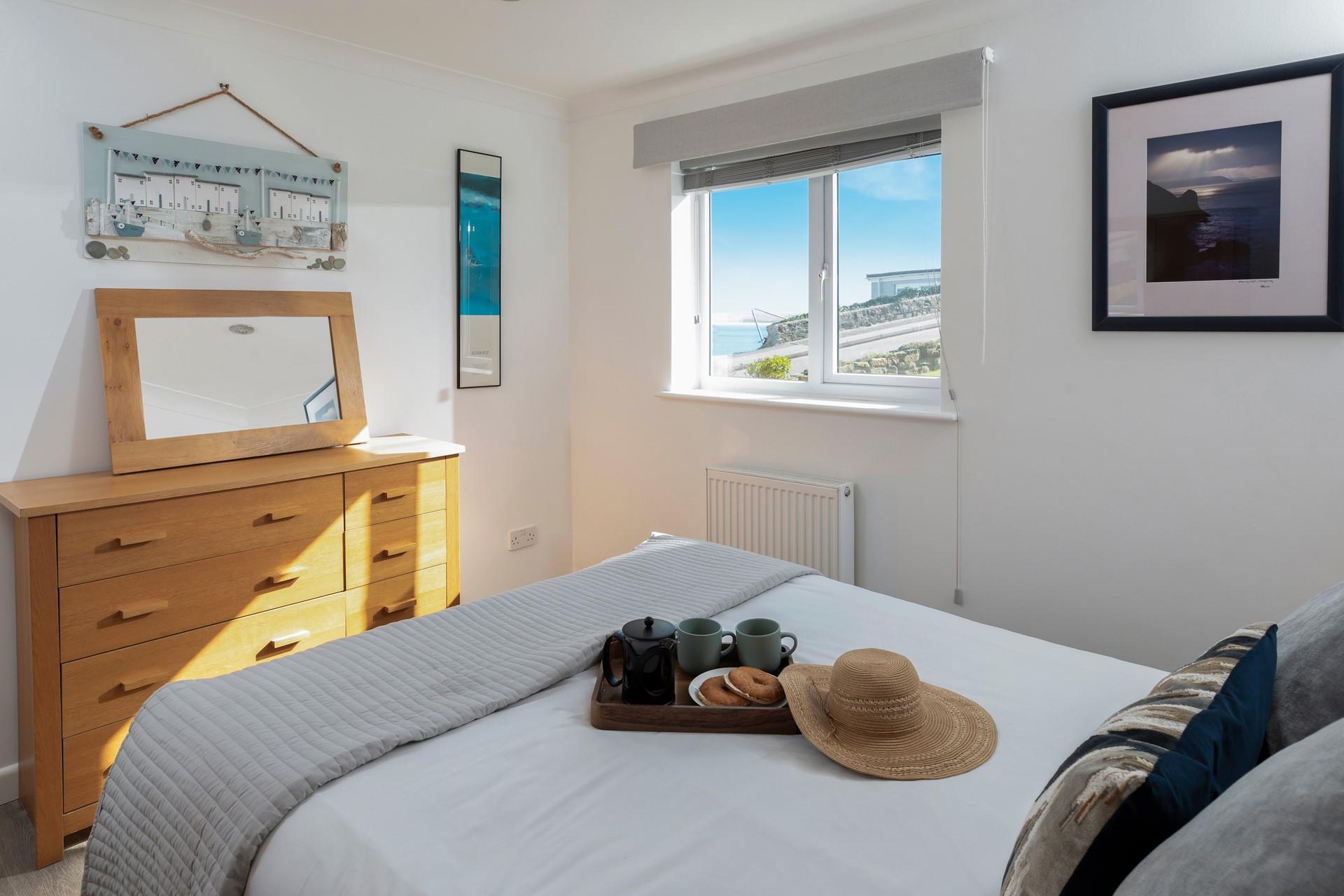 Wake up to glimpses of the sea whilst sipping your morning coffee.