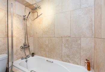 Indulge in a long shower under the feature rainfall shower head.
