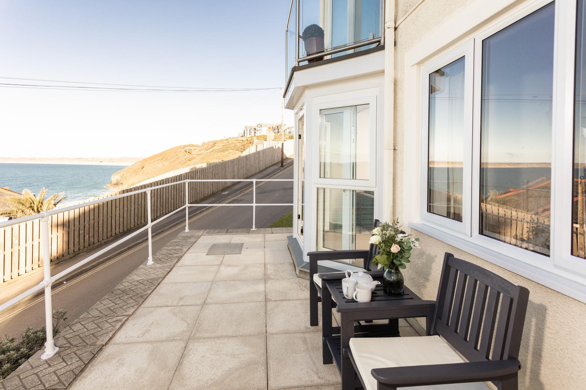 Sit out the front of the apartment and watch the waves.