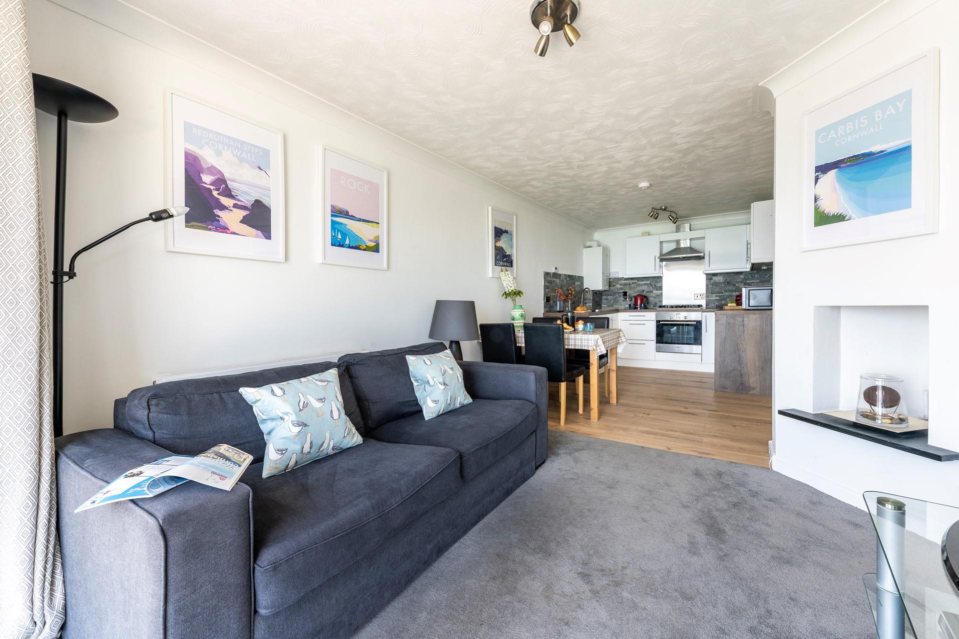 Relax in the open plan living space while the summer breeze flows through the apartment.