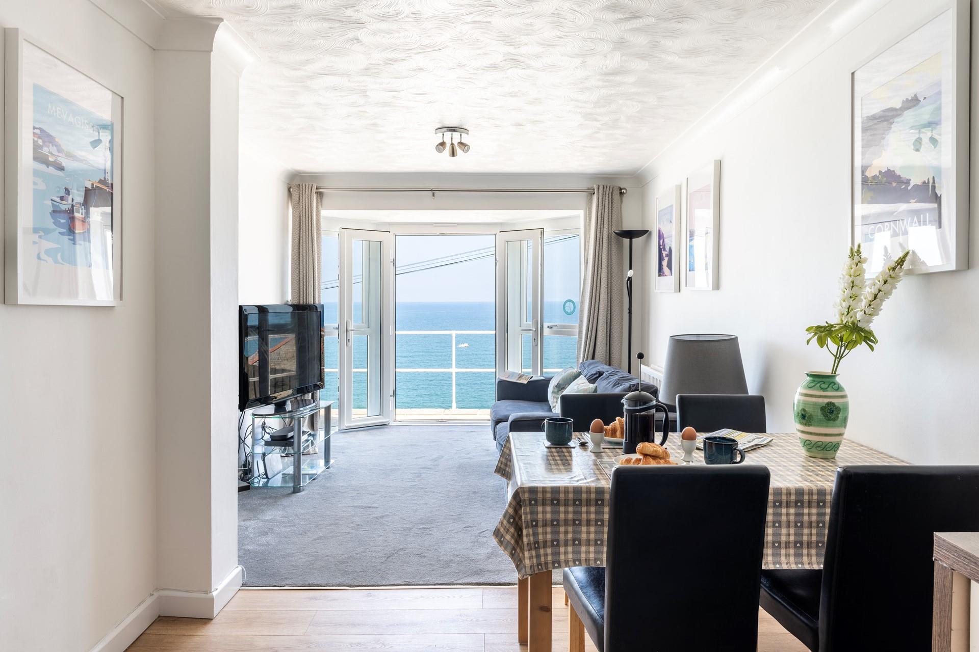 The open plan dining and sitting room means you can make the most of the views from the sofa or the dining table. 