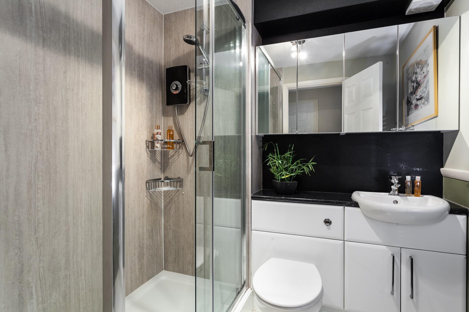 Finished to a high standard, the shower room is modern and stylish.