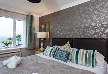 Beautifully designed with an elegant feature wall, the bedroom has a luxurious and romantic finish. 