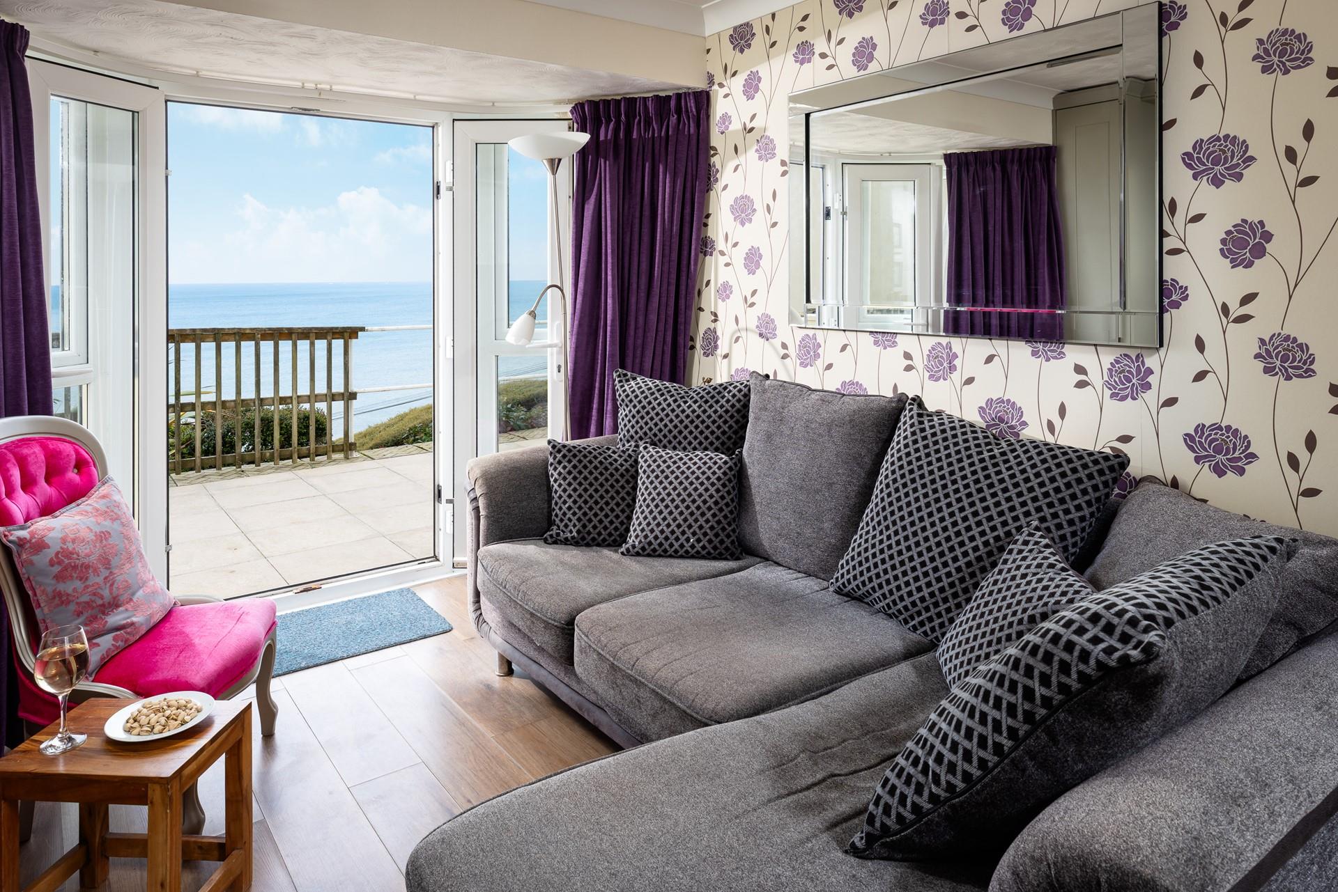 Throw open the French doors and admire the sea views from the private patio area.