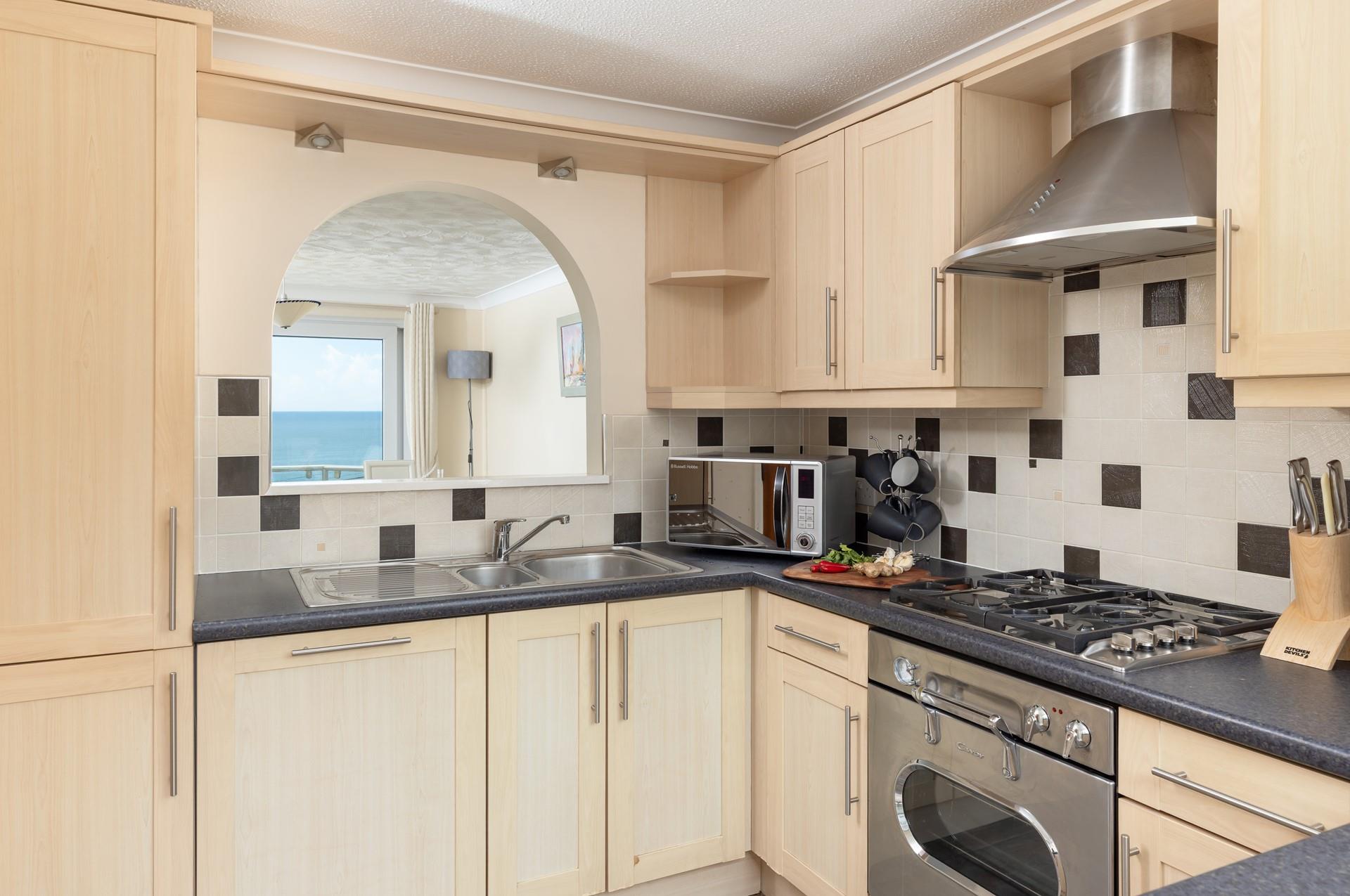 Enjoy glimpses of the sea from the kitchen.