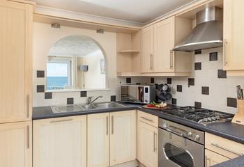 Enjoy glimpses of the sea from the kitchen.