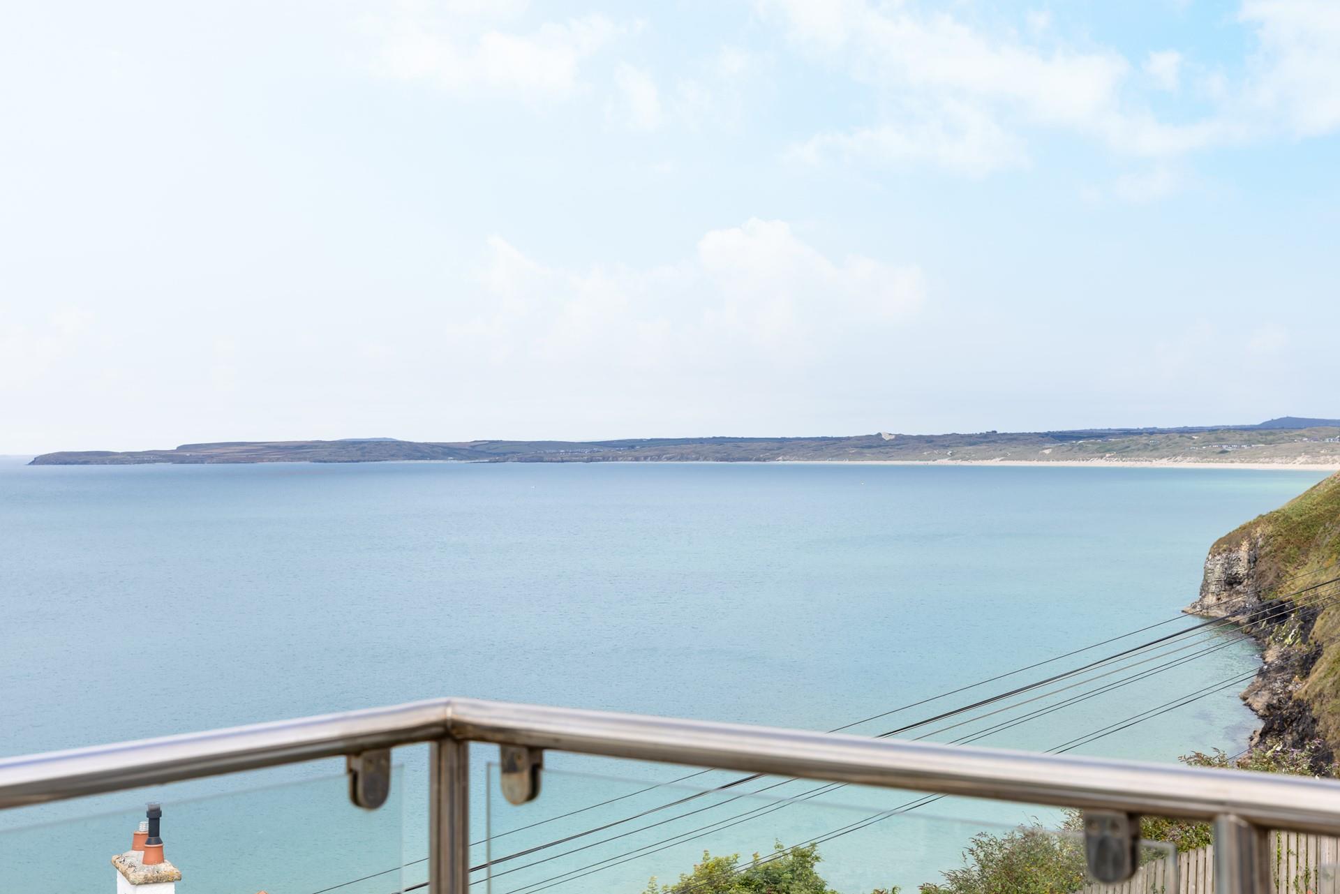 Take a moment to relax on the balcony, admiring the blue skies and far-stretching views. 