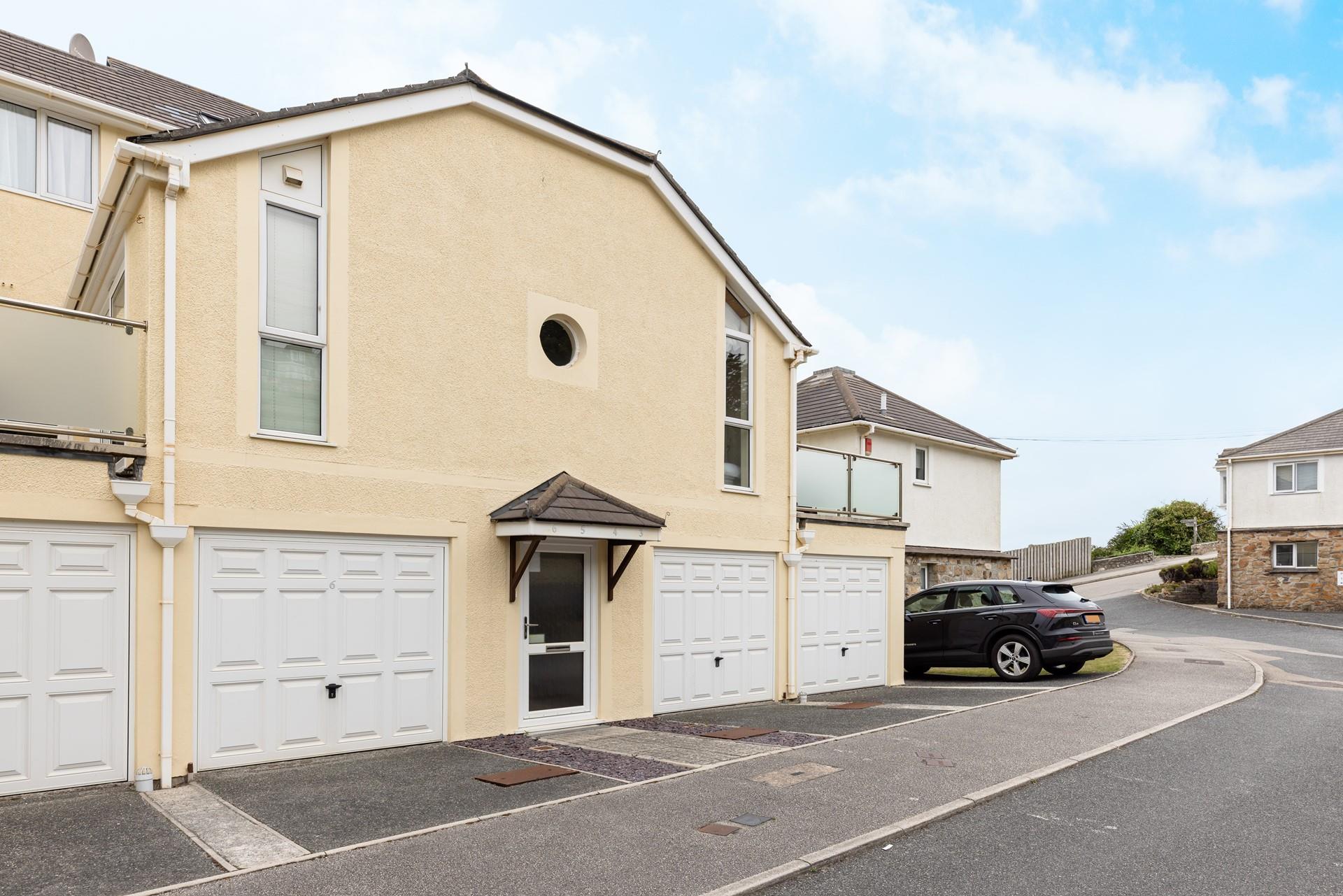 Sandy Bay comes with garage storage for beach gear and a private parking space.