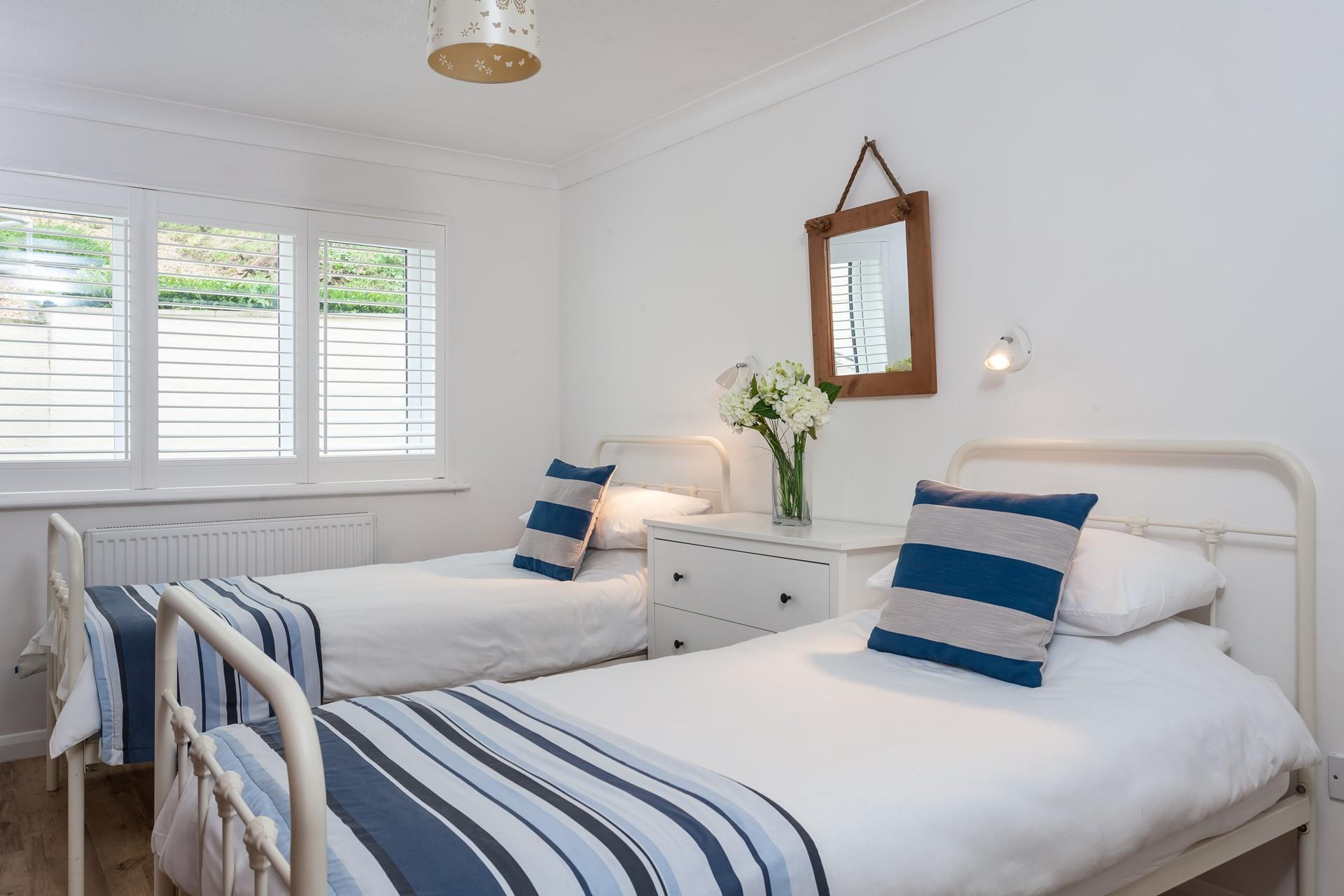 Light and airy, bedroom 2 benefits from a large window. 