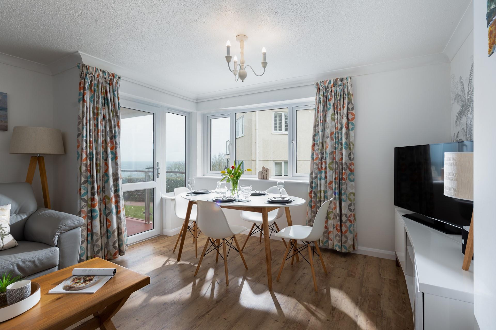 Sit around the table as a family and enjoy a meal together.