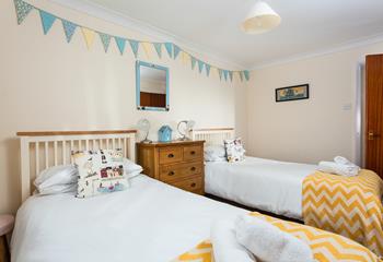 Bedroom 2 features twin beds and is ideal for two children or adults sharing.