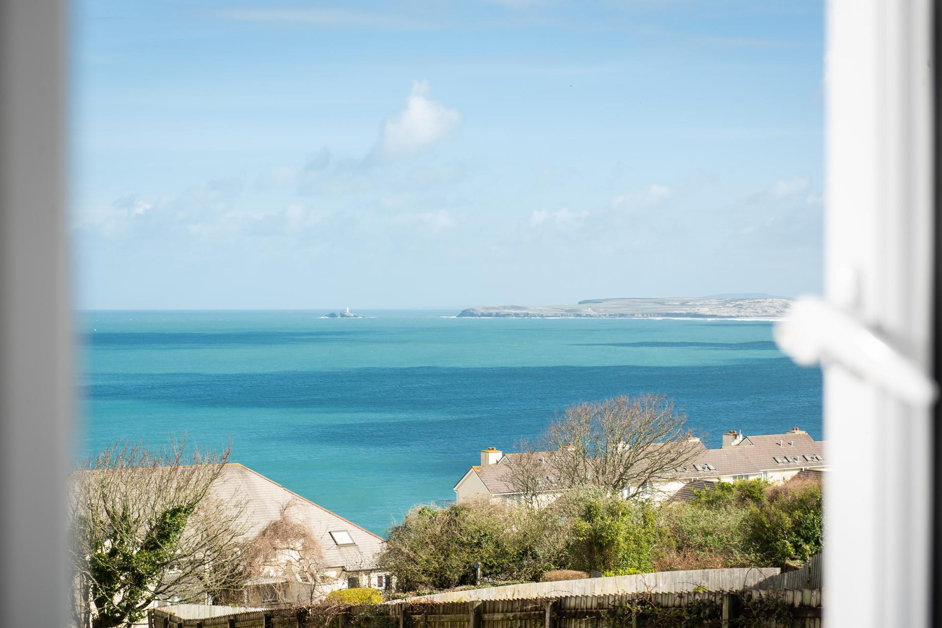 Godrevy Lighthouse can be seen in the distance of this stunning view. 