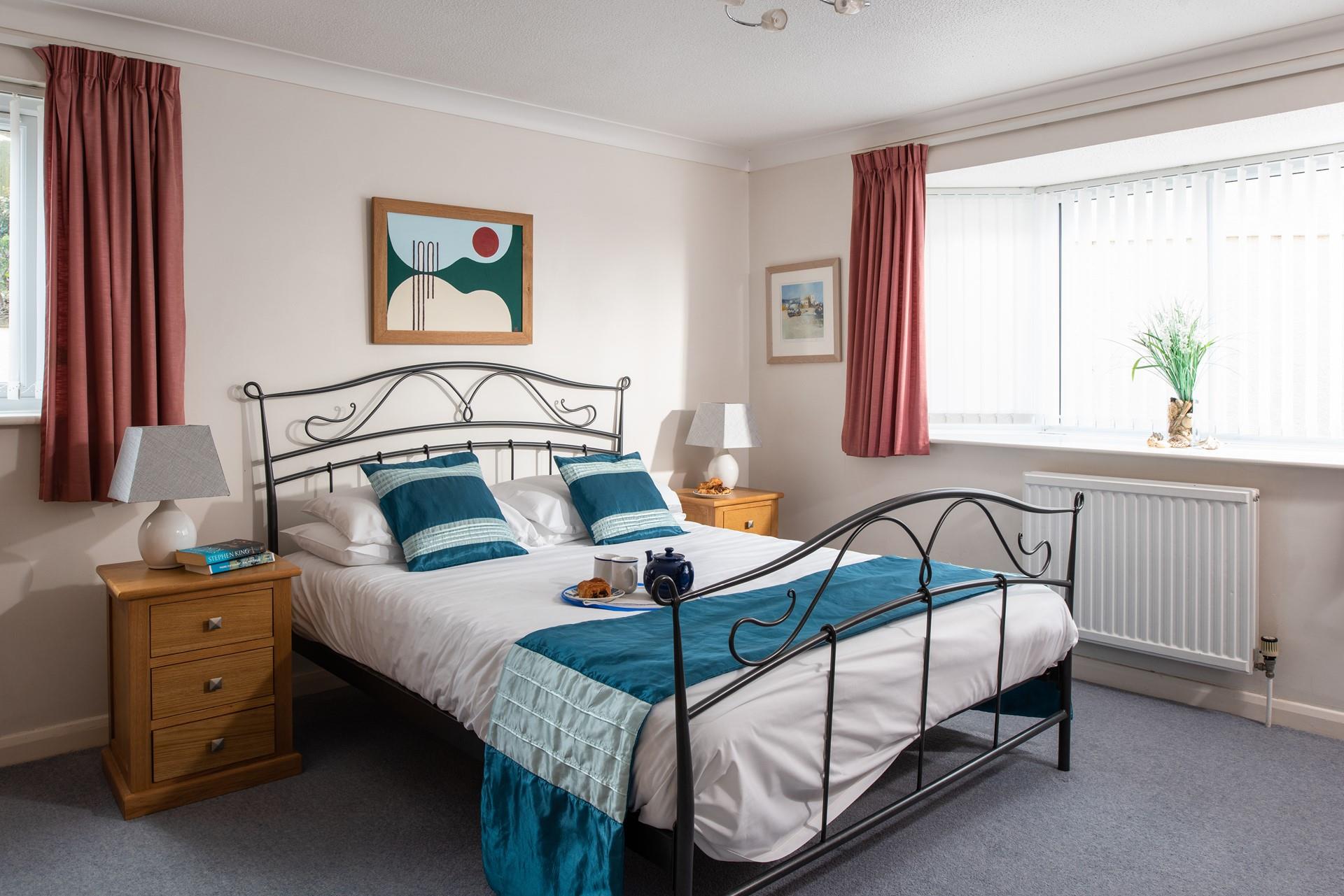 The spacious double bedroom is beautifully bright and airy.