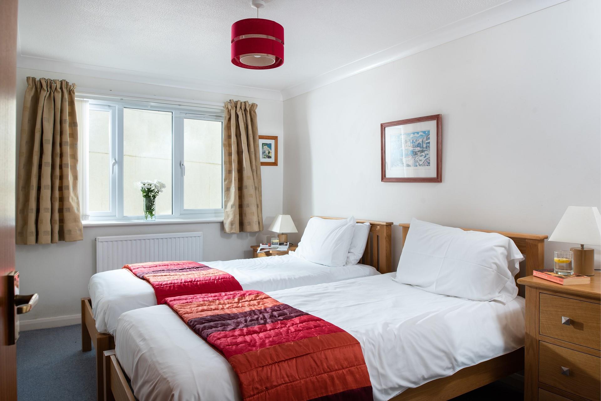 Bedroom 2 offers two sumptuously comfortable beds.
