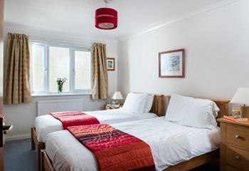 Bedroom 2 offers two sumptuously comfortable beds.