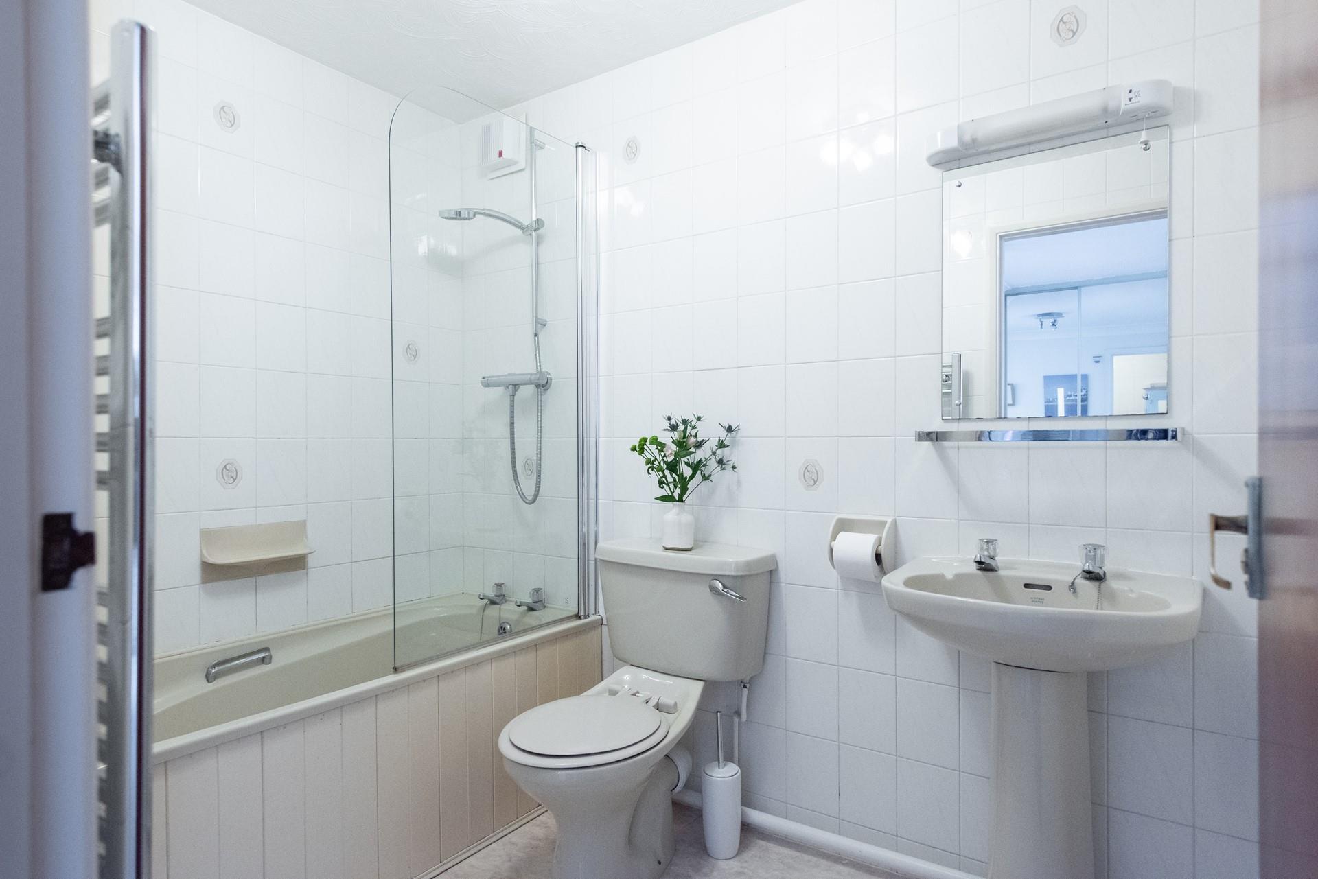 The family bathroom features a bath and shower so you can shower off sandy toes or soak in a relaxing bath.