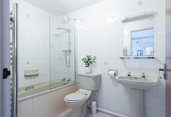 The family bathroom features a bath and shower so you can shower off sandy toes or soak in a relaxing bath.