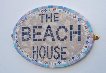 Beautifully finished, this unique house sign adds character and love to the cottage.