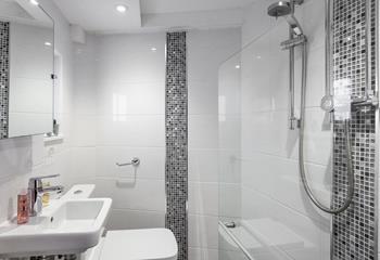 The modern en suite offers privacy and convenience.