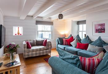 Through the archway, the second sitting room offers an additional space to enjoy a moment of calm.