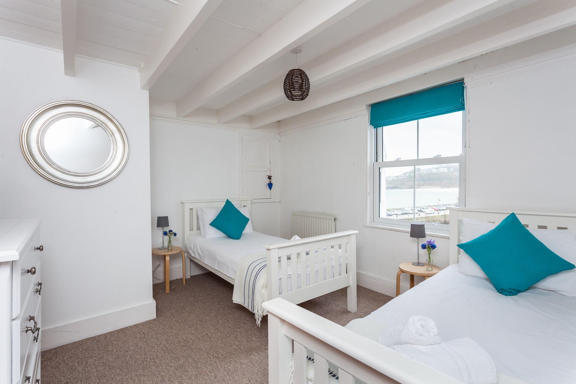 Bedroom 4 boasts views across the harbour. 